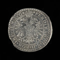talar Rzeszy - Ujęcie awersu. Na awersie monety pod koroną dwugłowy orzeł cesarski i napis w otoku.