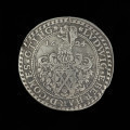 talar Rzeszy - Ujęcie rewersu. Na rewersie monety hiszpańska tarcza herbowa z labrami i hełmem z klejnotem dzielącym datę 16 - 24 i napis w otoku.