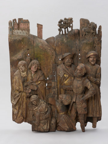 sztuka sakralna, kwatera ołtarza, płaskorzeźba - Ujęcie z przodu; Płaskorzeźba przedstawiająca grupę postaci skupionych pod krzyżem Chrystusa na wzgórzu Golgoty. Kwatera centralna późnośredniowiecznego ołtarza pasyjnego z Wkryujścia (Ueckermünde).