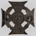 ML/MART/373 - Krzyż harcerski 4-ramienny wykonany z metalu, na środku lilijka harcerska, krzyż otaczają liście wawrzynu; napis na bocznych ramionach 