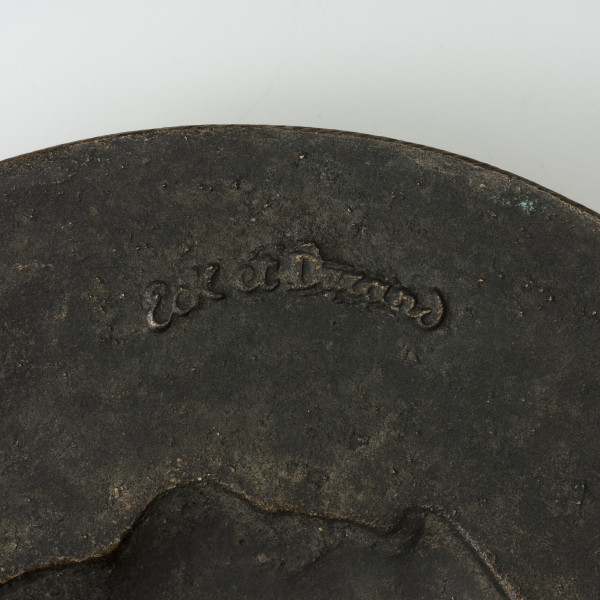 Medalion z wizerunkiem Karola Levittoux - detal; Widoczny znak odlewniczy z nazwą firmy Eck et Durand.