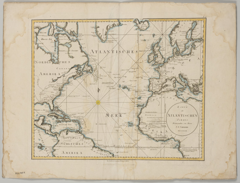 Mapa Oceanu Atlantyckiego - ujęcie z przodu; Mapa Oceanu Atlantyckiego kolorowana – ramka lawowana na żółto, wybrzeża na zielono i brzegi mórz na niebiesko. Poza ramką mapy napisy: na dole centralnie - 