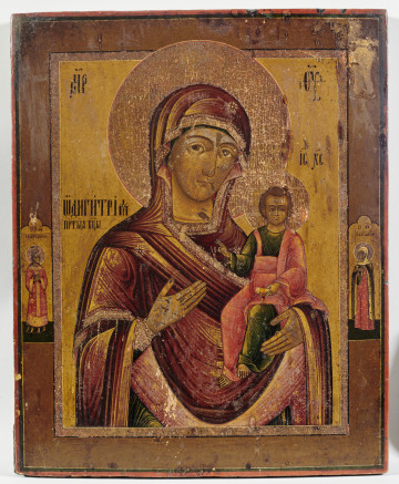 ikona Bogurodzica Hodigitria Smoleńska w półpostaci; Dzieciątko siedzi po prawej stronie, prawicą błogosławi, w lewicy trzyma zwinięty zwój