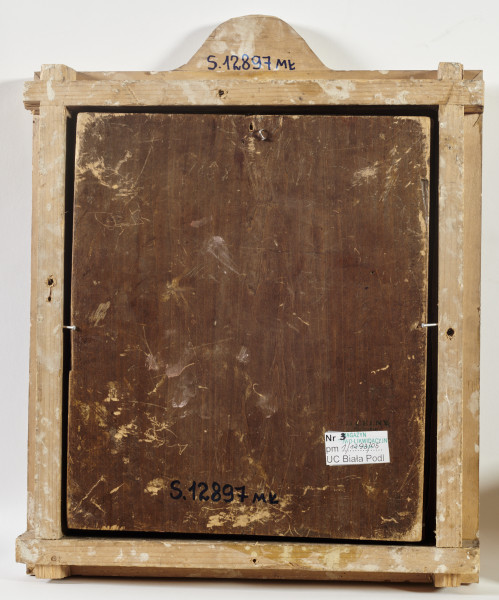 ikona w okładzie srebrnym złoconym, z wizerunkiem Bogurodzicy Radość Strapionych w całej postaci, z berłem w prawicy, stojącej wśród zwróconych do niej postaci, z towarzyszącymi aniołami, w zwieńczeniu półpostać Chrystusa Pantokratora; na lewym pasie bordiury św. Bazyli Męczennik 