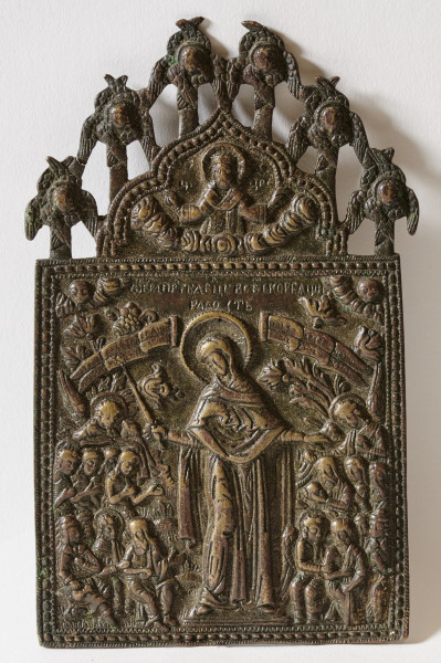 ikona z wizerunkiem Bogurodzicy stojącej w całej postaci wśród aniołów, chorych i potrzebujących trzymających banderole z cyrylickimi wezwaniami modlitewnymi; w zwieńczeniu półpostać Chrystusa Pantokratora.